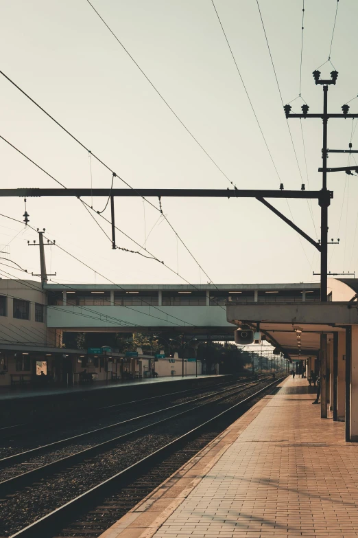 an empty station with a train going underneath