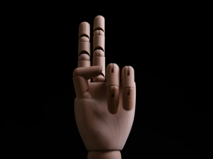 an animation image of a hand that has five fingers extended and four fingers out with eyes drawn