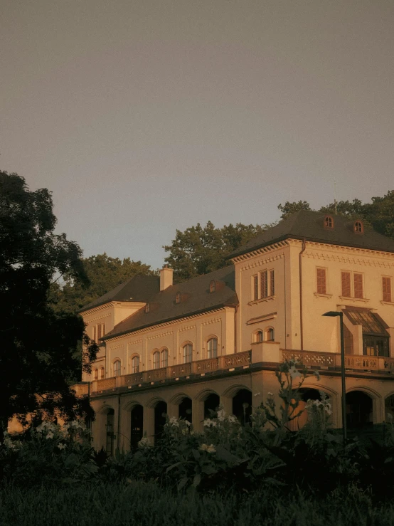 old building with lots of windows on a hill