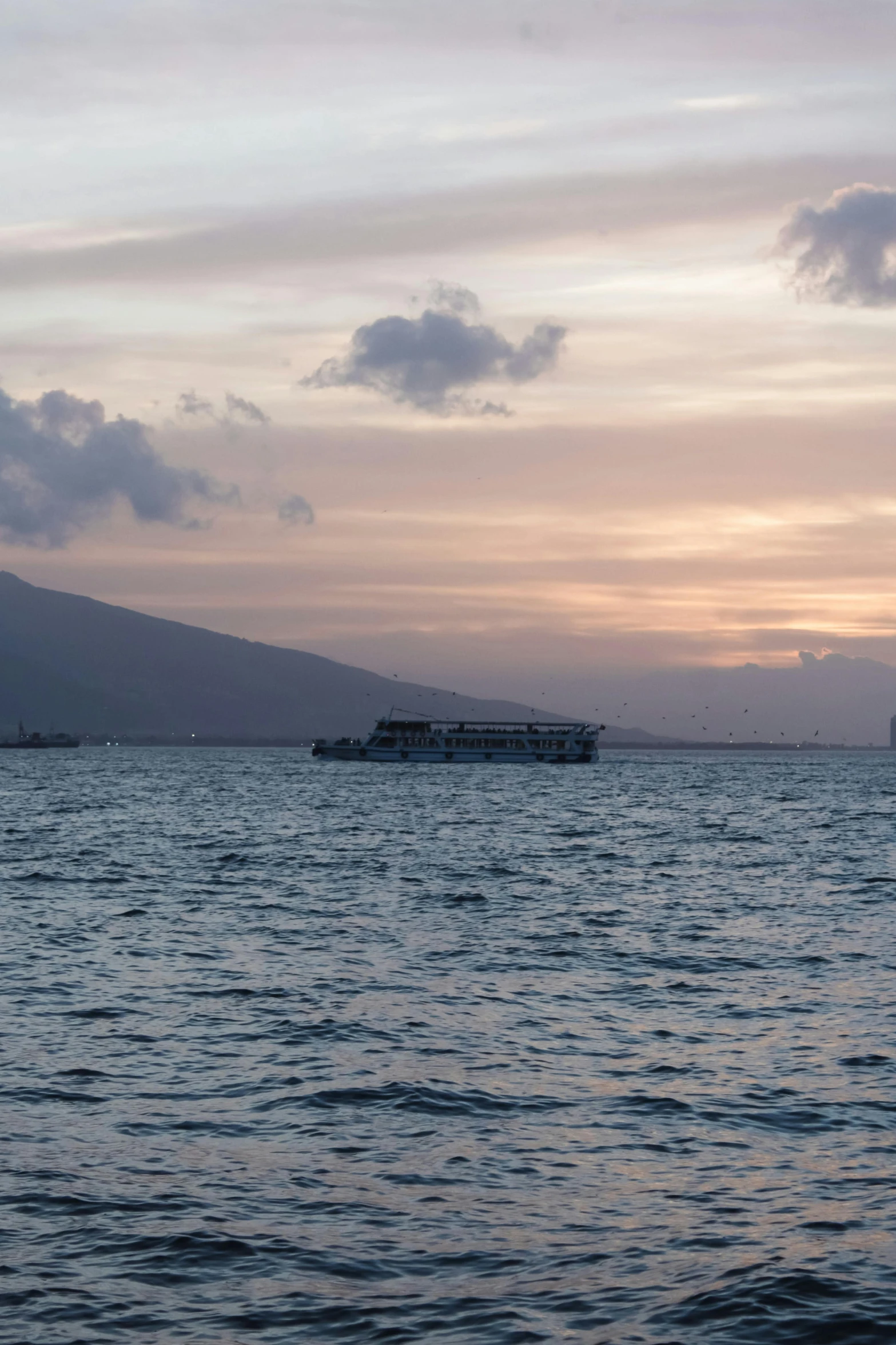 there is a long boat that is out on the water