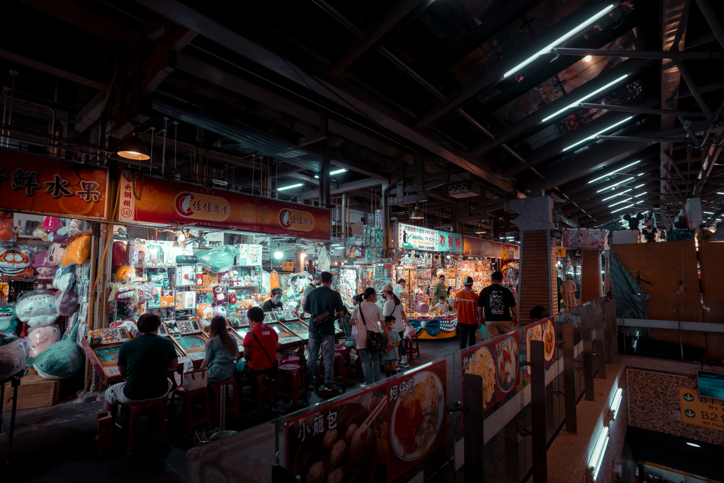 people in the shop area of an asian food vendor