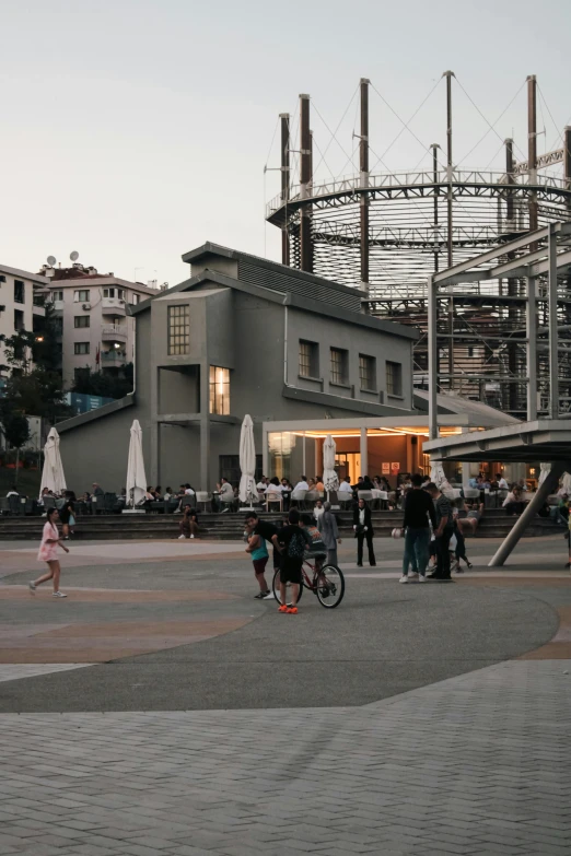 people crossing on street in front of large building