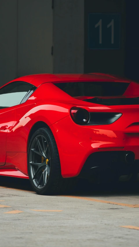 red sports car with chrome roof parked in a garage