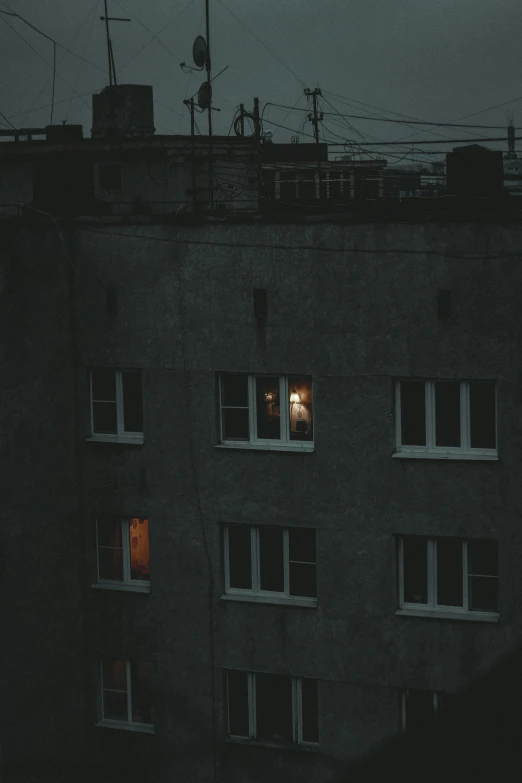 a building with several windows in the dark