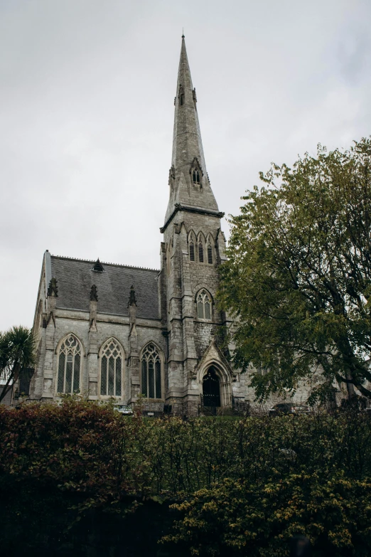 a large old church with a steeple and a tower