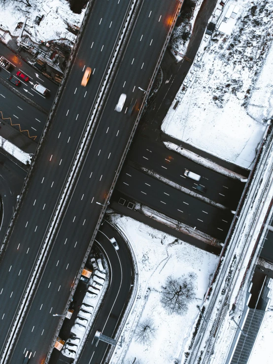 an aerial view of a city street in winter