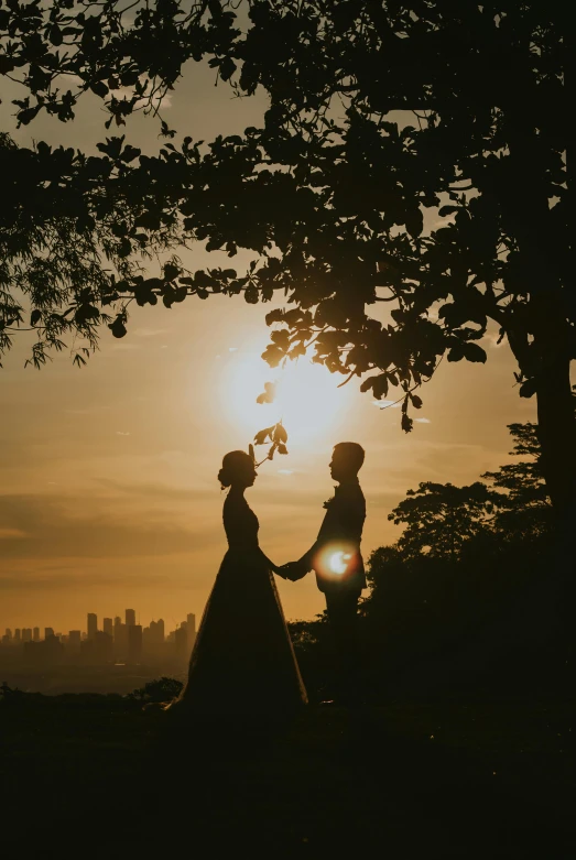 an image of people walking through the sun set