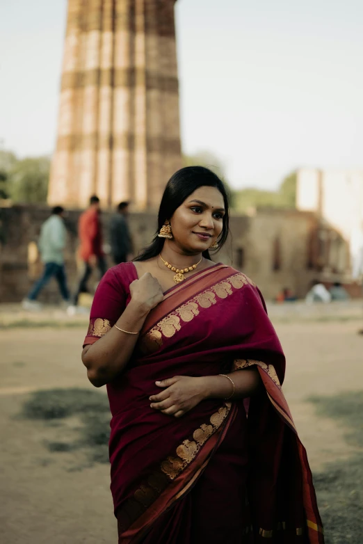 a woman standing in front of the temple