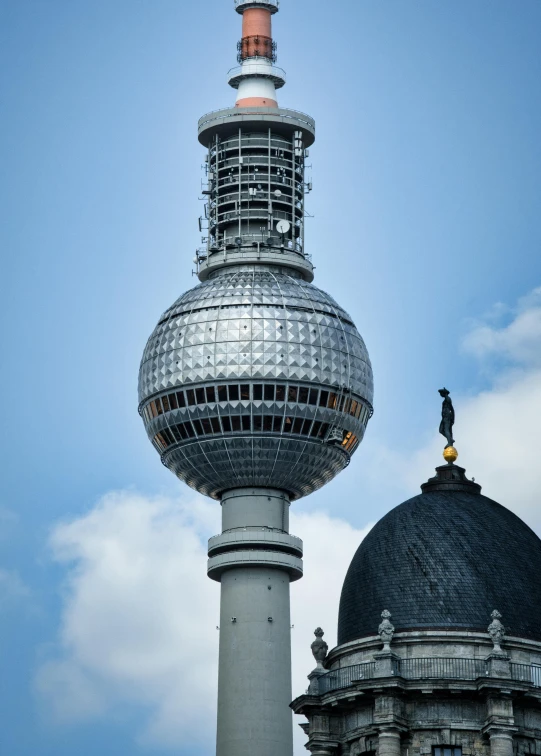 a very tall building with some clocks on top of it