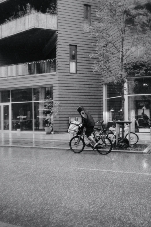 a person is riding their bicycle on the sidewalk