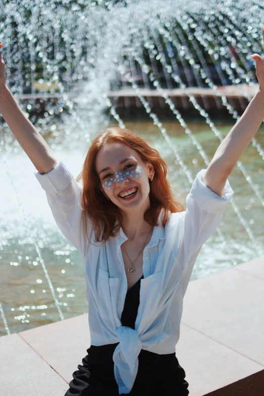 an image of girl posing with her arms in the air