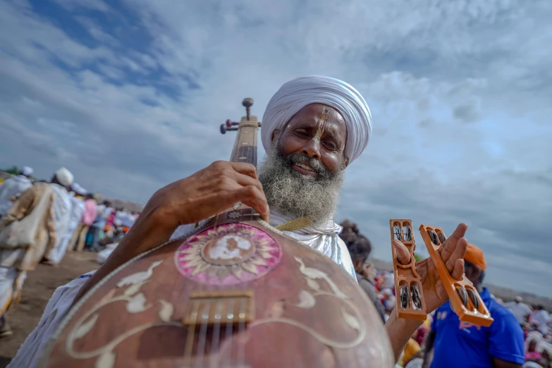 a man plays a musical instrument for the group