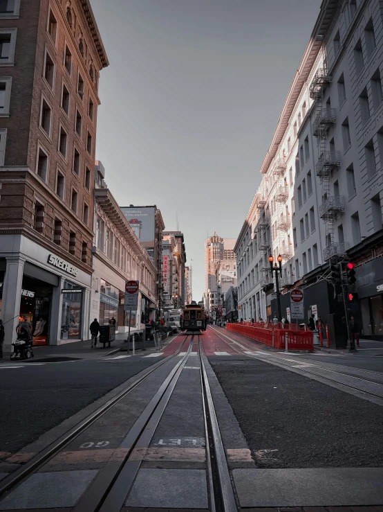 a traffic light sitting next to buildings on the street