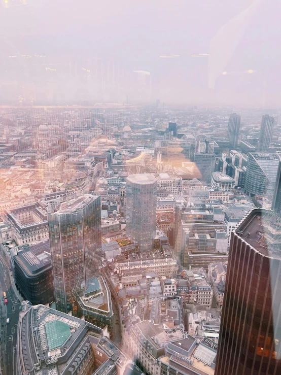 a view of a cityscape from the tall buildings