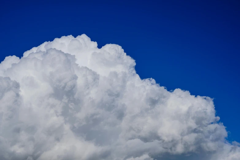 a huge cloud moves in towards the sky