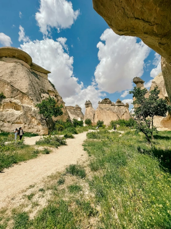 a dirt trail running through a rocky landscape