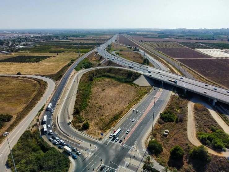 a large highway stretches into the distance with traffic on both sides