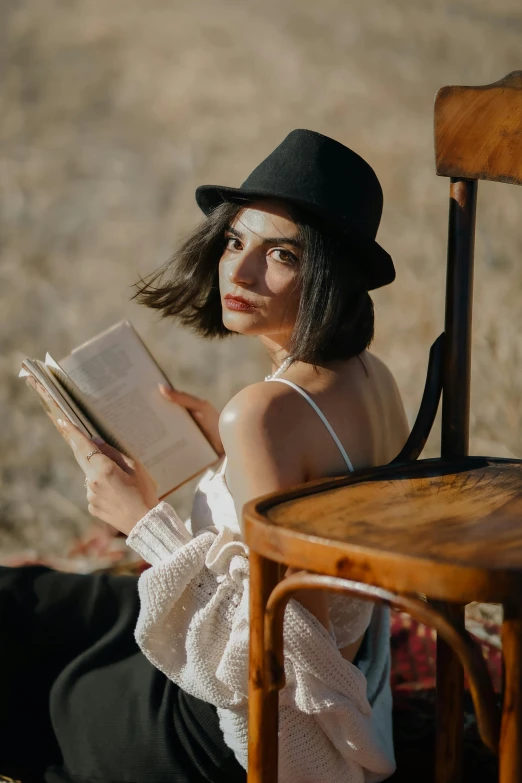 an image of a woman reading a book