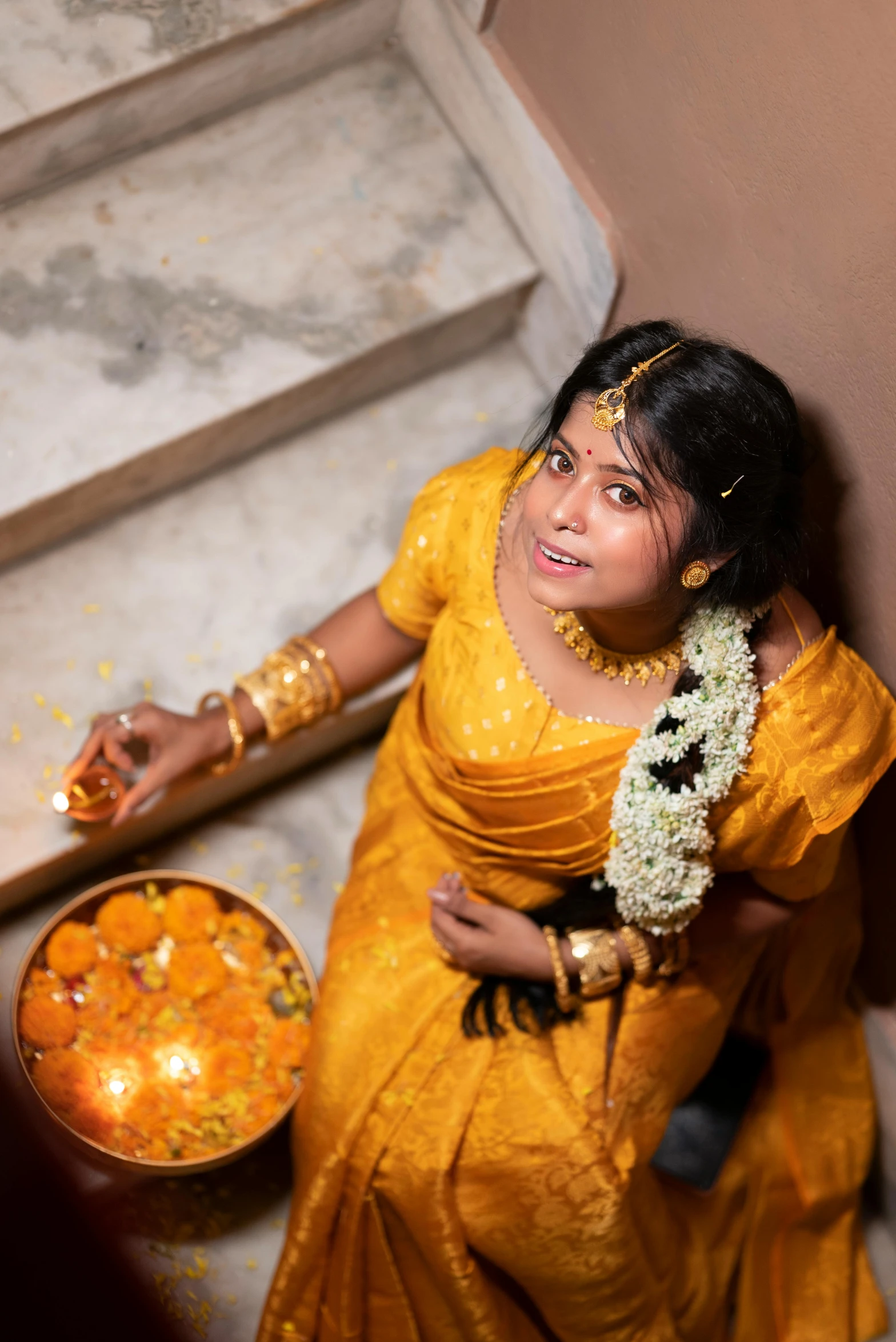 a woman is dressed in a yellow colored outfit