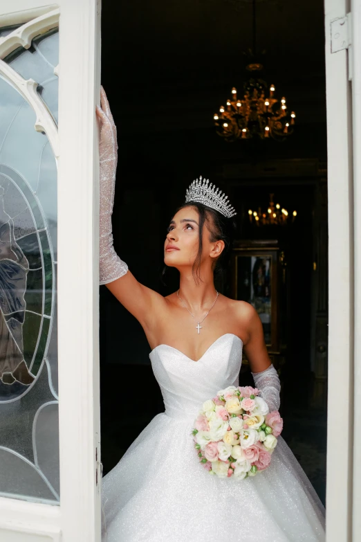 a bride standing with her arm in the air