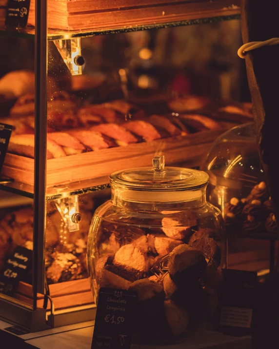 a table with jars and cookies sitting in the middle