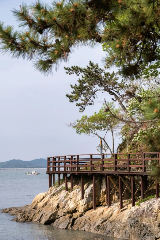 a bridge crosses over the ocean to a beach