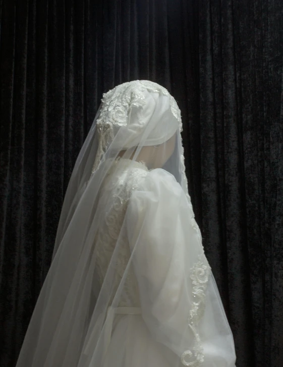 there is a veil on a mannequin for display
