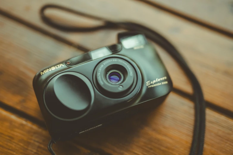 an old - fashioned digital camera is displayed on a table