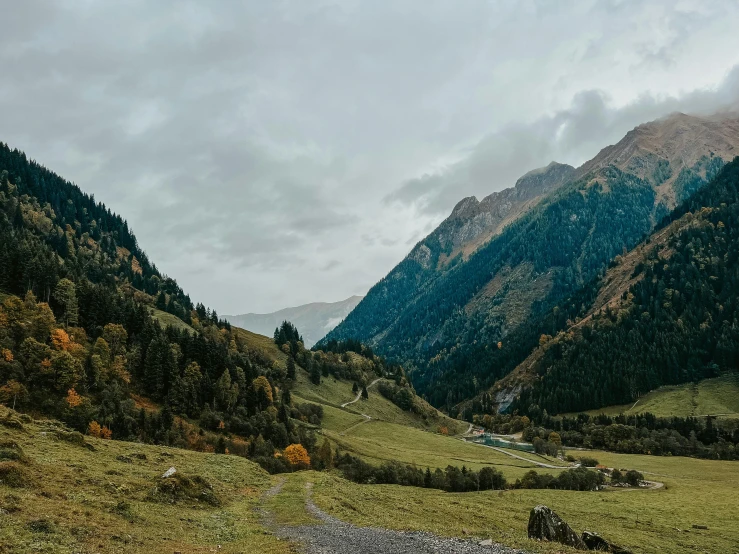 mountains that are next to each other and covered in grass