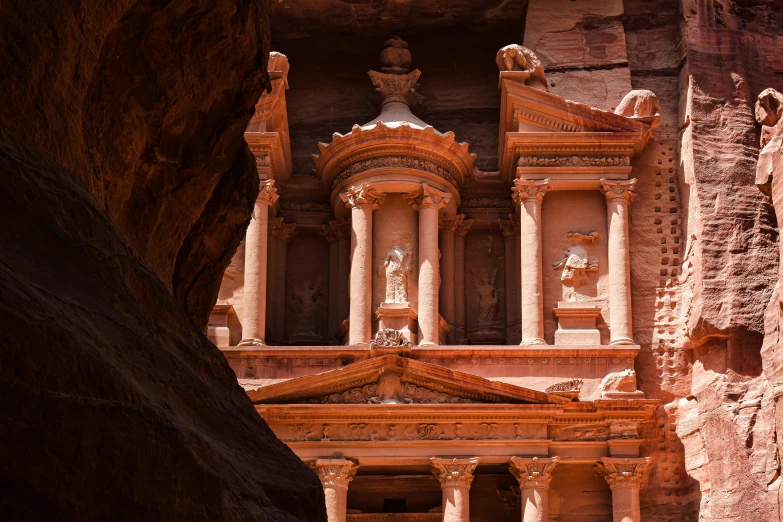 the exterior of an ancient rock structure in egypt