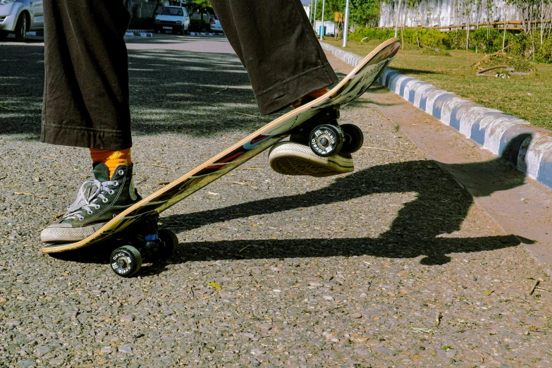 a person standing on a skateboard in the street