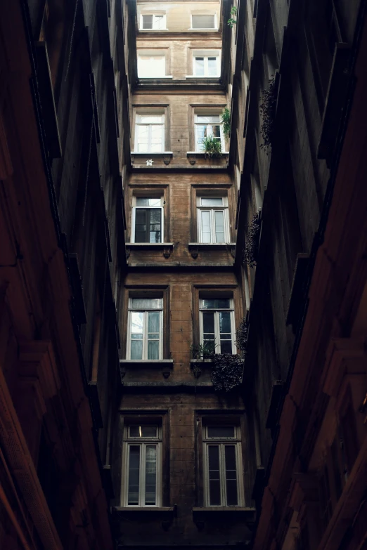 high - rise building with many windows, and balconyed area