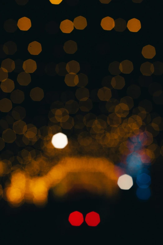 blurred lights on dark street with dark night sky