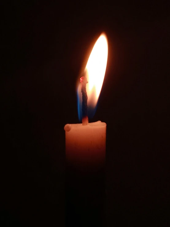 a lit candle that has been left on