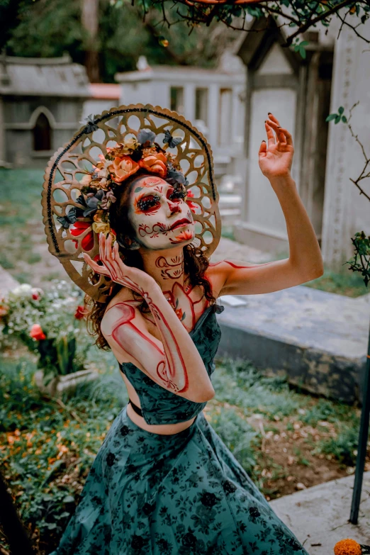 a girl wearing a face paint like a sugar skull