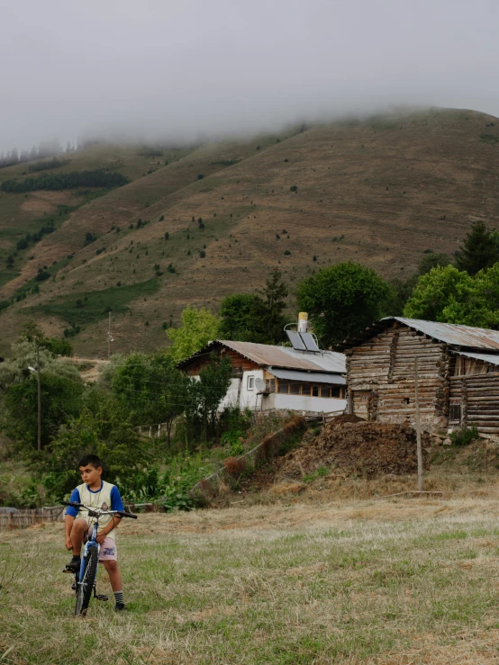 a  riding a bicycle through the mountains