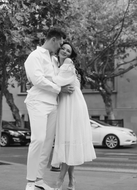 black and white po of man kissing woman