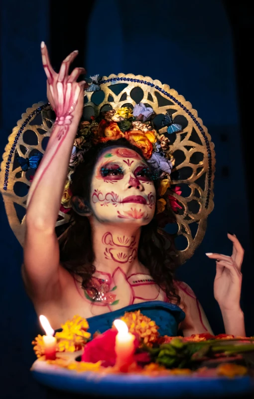 a beautiful woman with makeup painted like sugar skulls