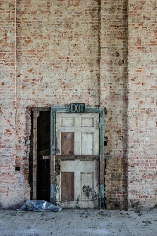 a weathered building that has a broken window