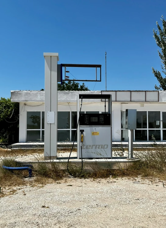 the gas station has been painted white and features a basketball hoop