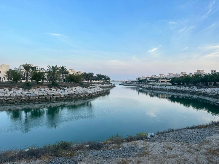 a blue river that is next to a city