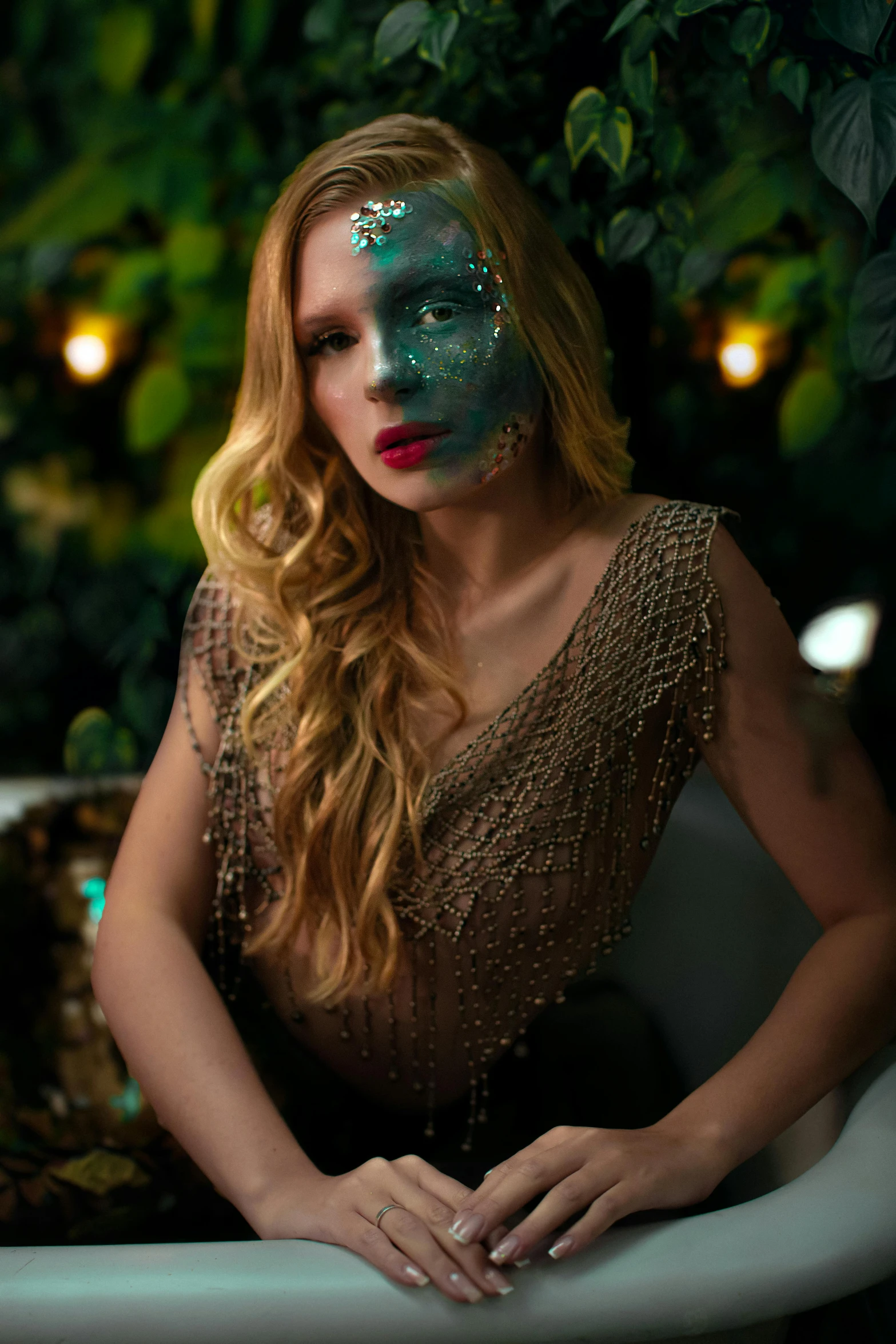 a woman with makeup and green make up