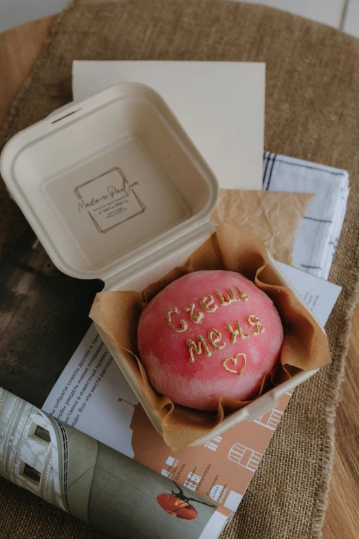 a cup and some food sitting in a box