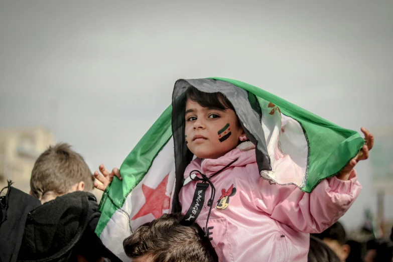 an image of a child wearing a flag