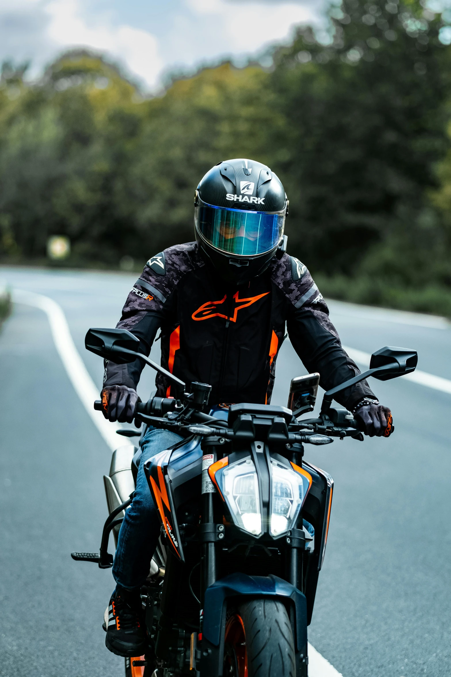 the man wearing a helmet is riding his motorcycle