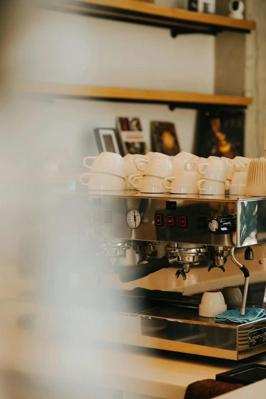 coffee beans and coffee pots are sitting on a table