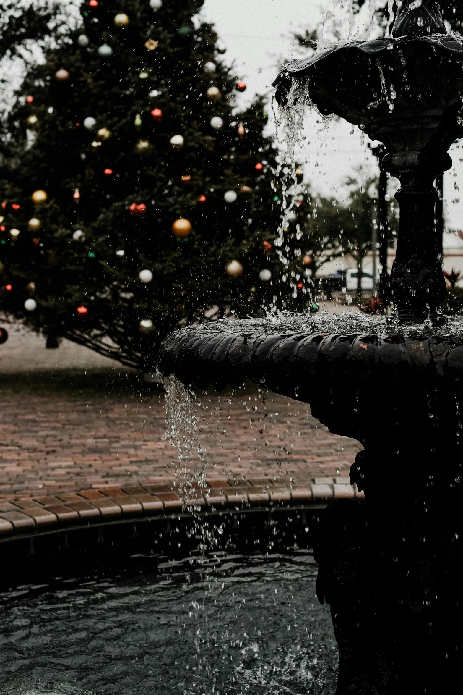 this is an image of a water fountain with people watching it