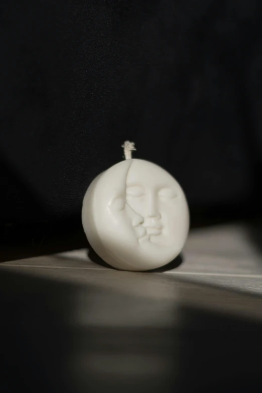 an item that is white and has a man's face on it