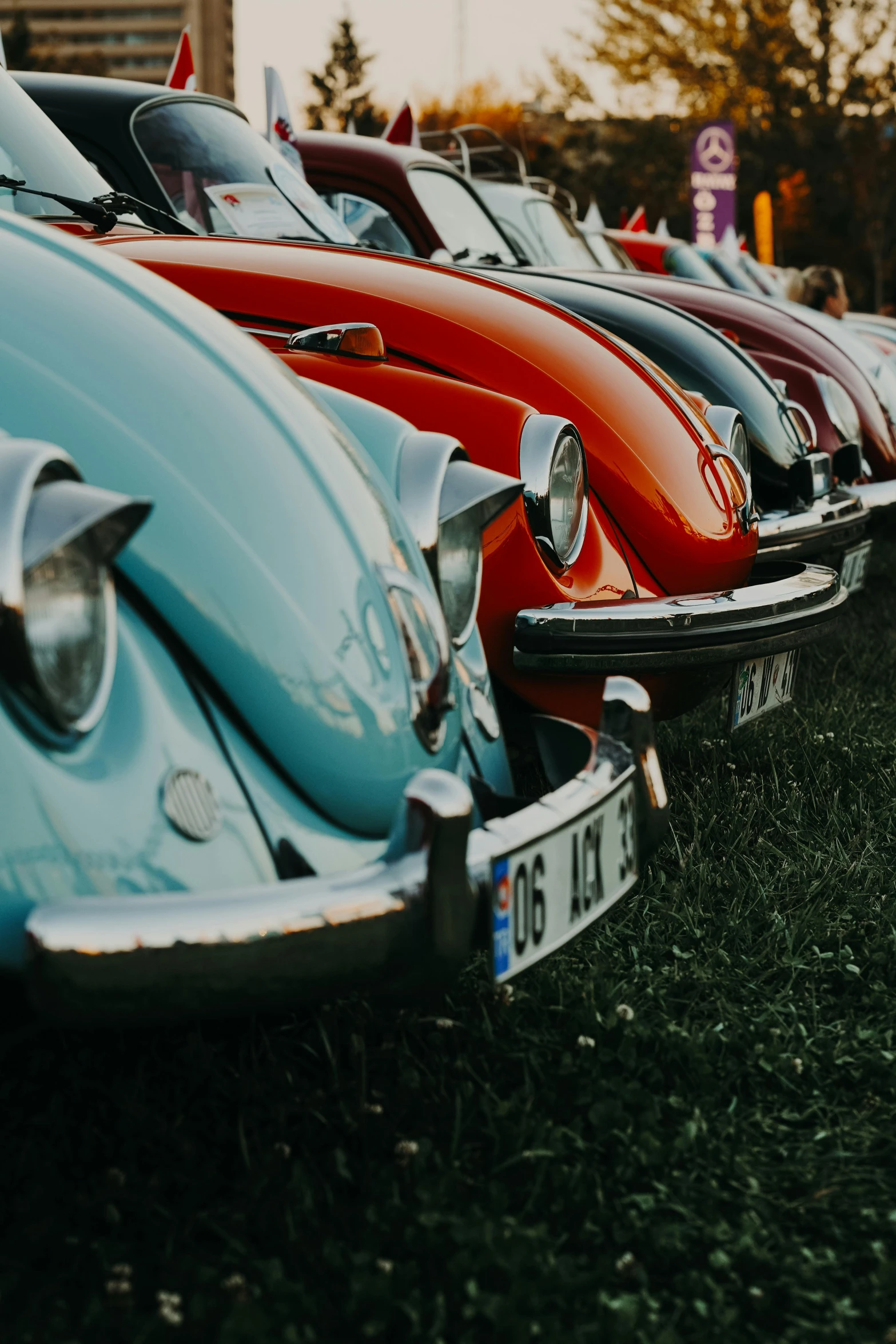 many classic cars are parked in a row