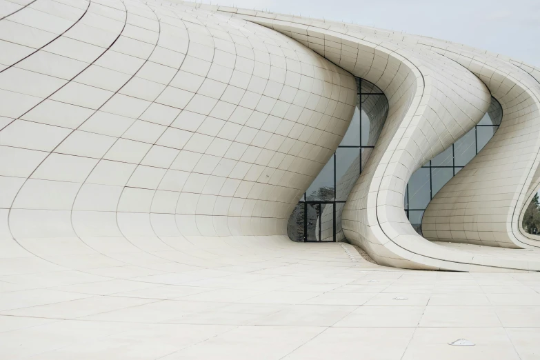 the side of a white building is partially closed and has lines on it